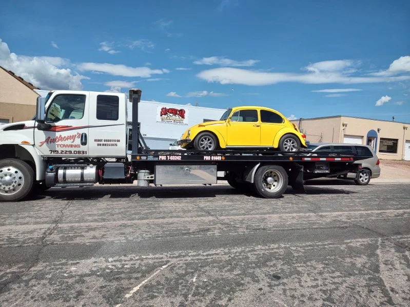 Yellow Car on a Flatbed Truck