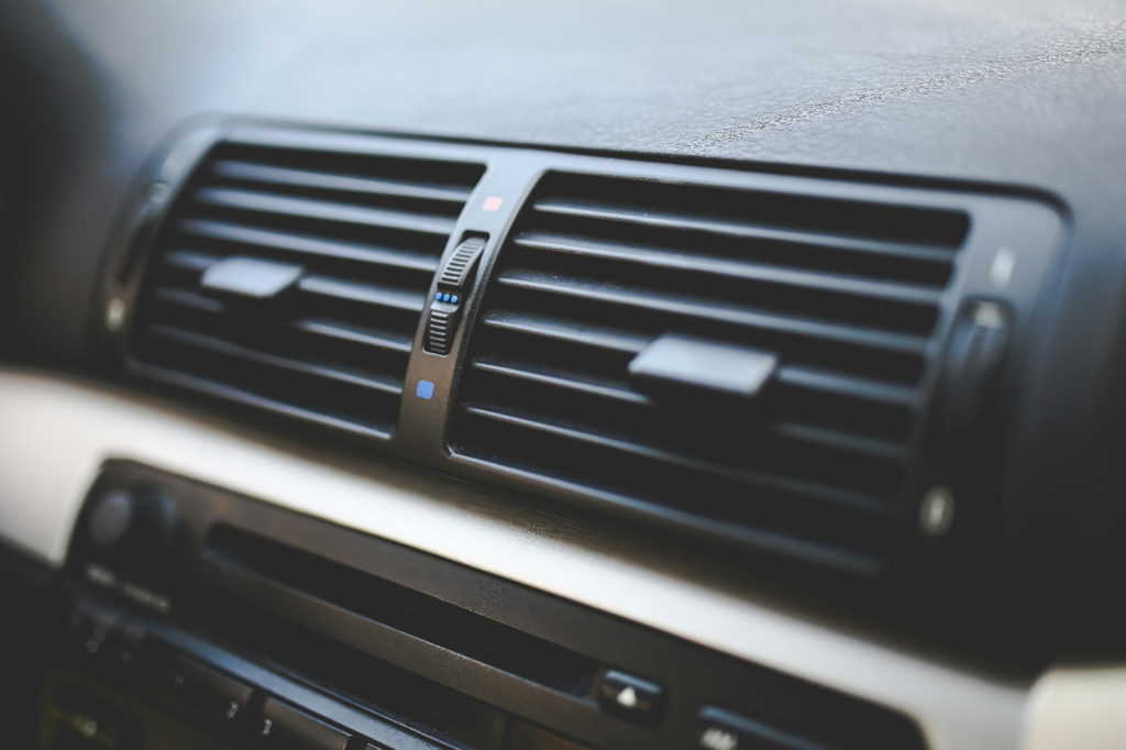 Detailed shot of car air conditioning vents, essential for maintaining a comfortable driving environment while maximizing fuel efficiency on the road.